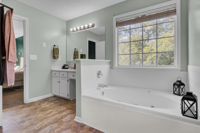 1600 Windsor Ln, Moncks Corner, SC 29461 - bathroom with ensuite bath, vanity, and a jetted tub