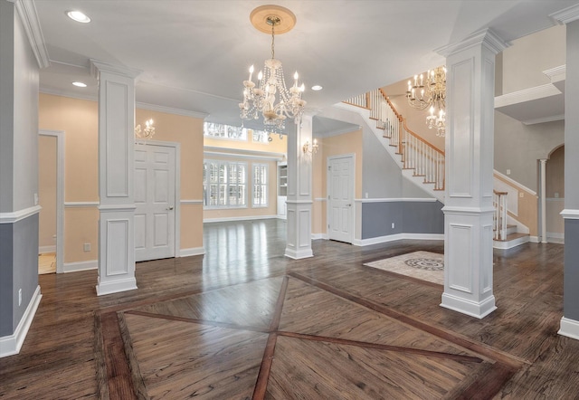 living room featuring decorative columns and a notable chandelier