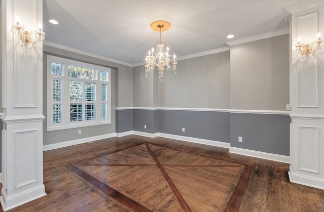 unfurnished dining area featuring crown molding, a chandelier, and decorative columns