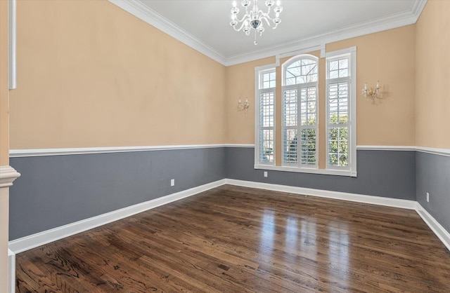 unfurnished room featuring ornamental molding, dark hardwood / wood-style floors, a wealth of natural light, and a notable chandelier