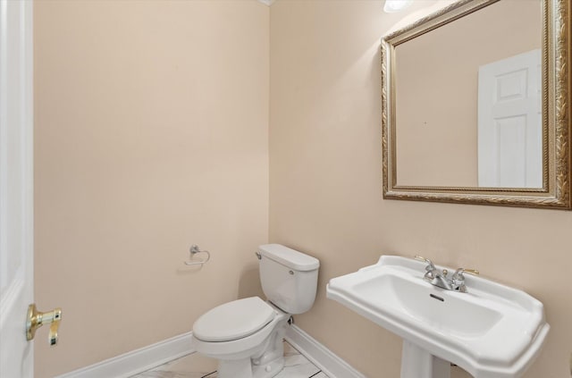 bathroom with sink and toilet