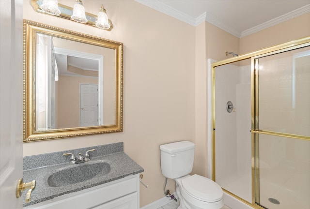 bathroom with vanity, crown molding, a shower with door, and toilet