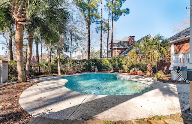 view of swimming pool featuring a patio area