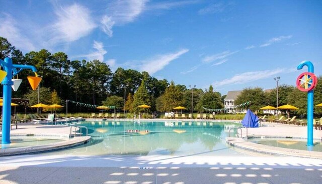 view of swimming pool with a patio area