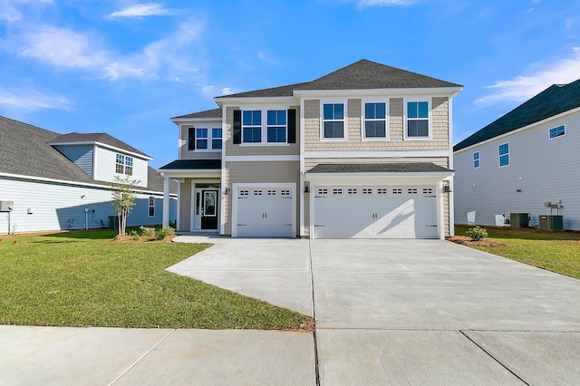 view of front of house featuring central AC, an attached garage, driveway, and a front lawn