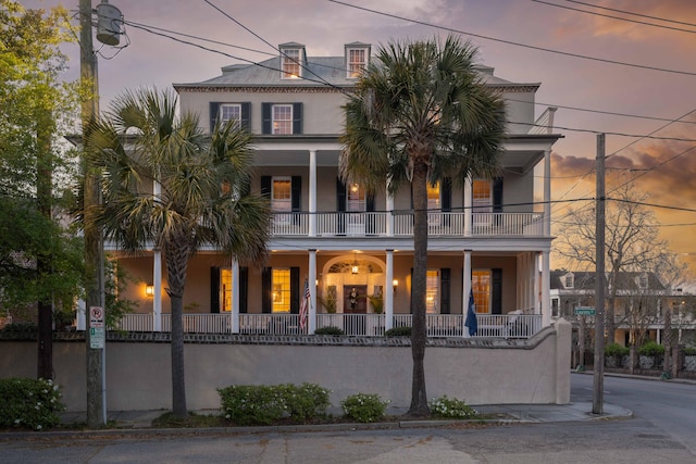 view of front of property with a balcony