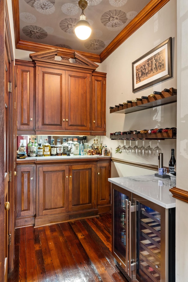 bar featuring ornamental molding, wine cooler, and dark wood-type flooring