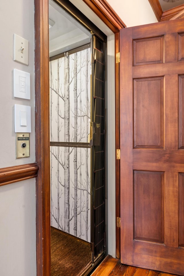 doorway to outside with hardwood / wood-style floors