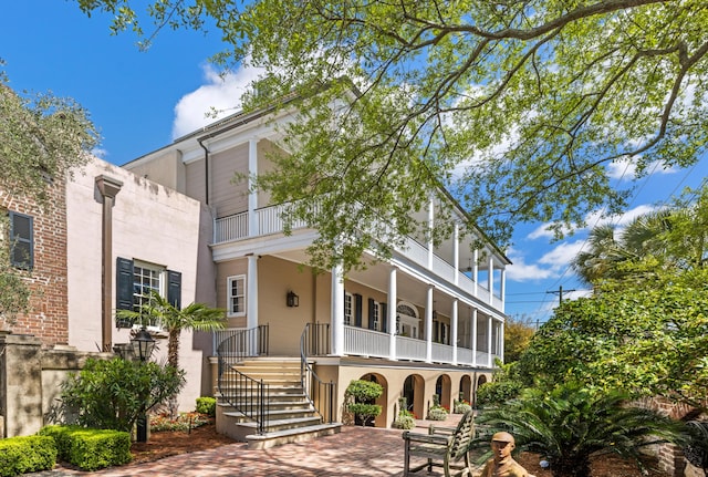 view of front of house with a balcony