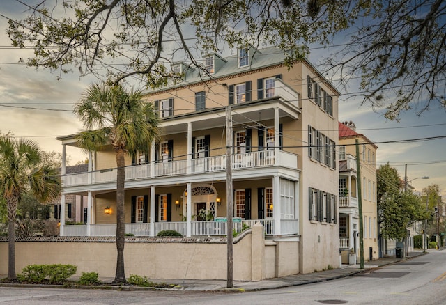 view of front of house featuring a balcony