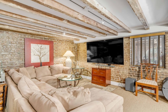 living room featuring beamed ceiling, light colored carpet, and brick wall