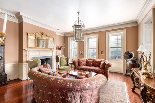 living room featuring hardwood / wood-style flooring and ornamental molding