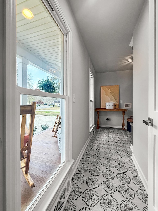 corridor featuring baseboards