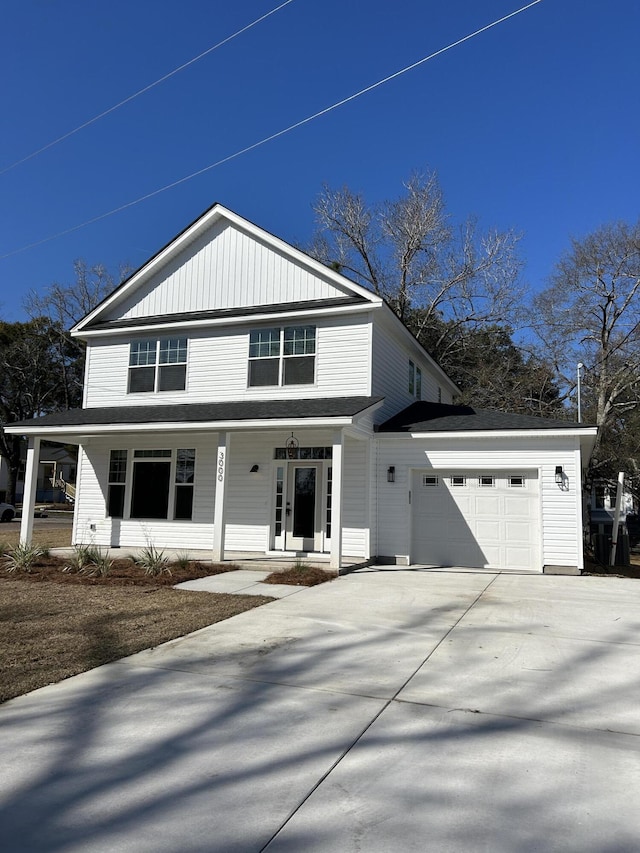 view of front facade with an attached garage, covered porch, and driveway