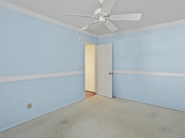 unfurnished room featuring ceiling fan and crown molding