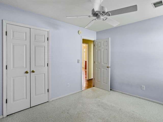 unfurnished bedroom featuring a closet and ceiling fan