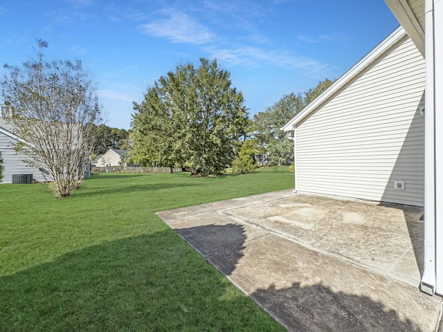 view of yard featuring a patio area and central AC