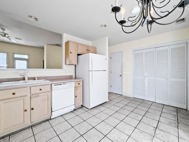 kitchen featuring light brown cabinetry, ceiling fan with notable chandelier, white appliances, sink, and light tile patterned floors