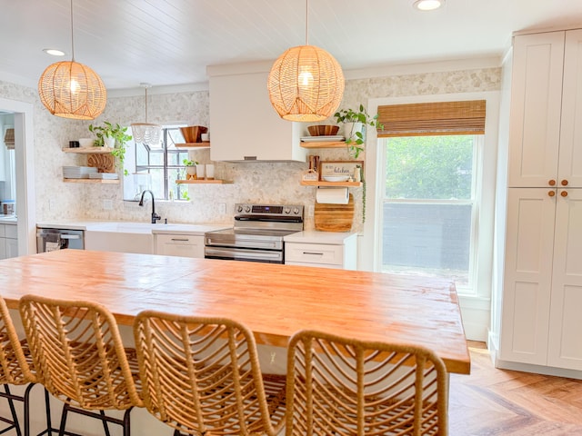 27 Fitzroy Dr, Charleston, SC 29414 - kitchen with open shelves, stainless steel appliances, plenty of natural light, a sink, and crown molding