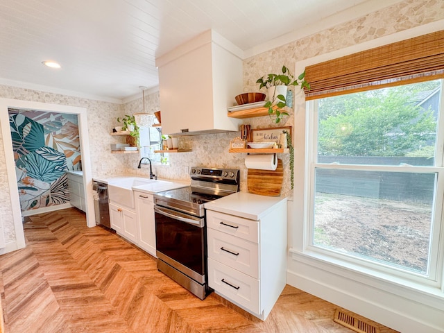 27 Fitzroy Dr, Charleston, SC 29414 - kitchen with open shelves, stainless steel appliances, a sink, healthy amount of natural light, and ornamental molding