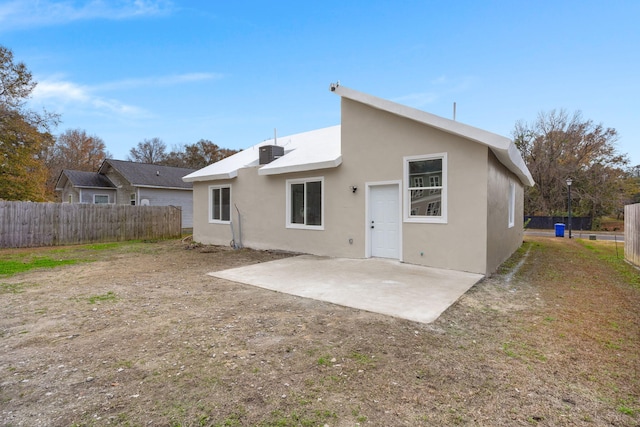 rear view of property featuring a patio area