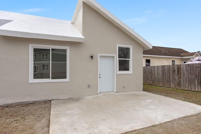 rear view of house featuring a patio