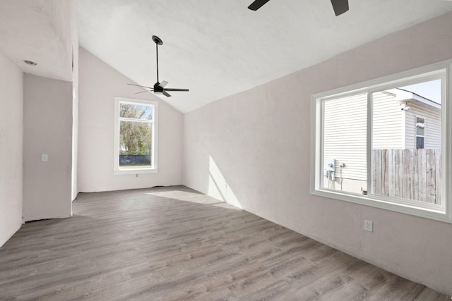 interior space with lofted ceiling and light hardwood / wood-style flooring