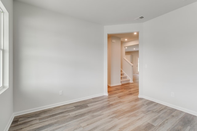 spare room featuring light hardwood / wood-style floors