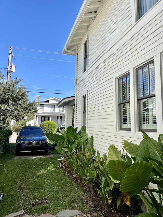 view of home's exterior with a yard