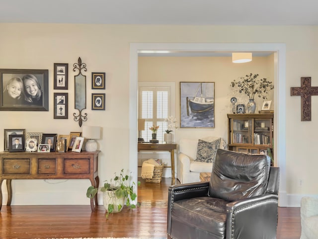 living area with hardwood / wood-style flooring