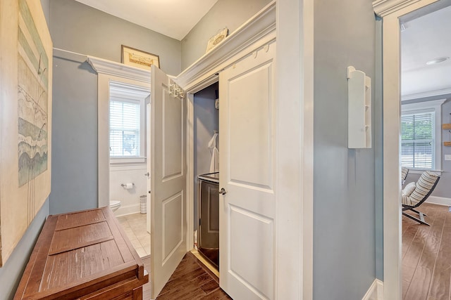 mudroom with healthy amount of natural light, wood finished floors, and baseboards