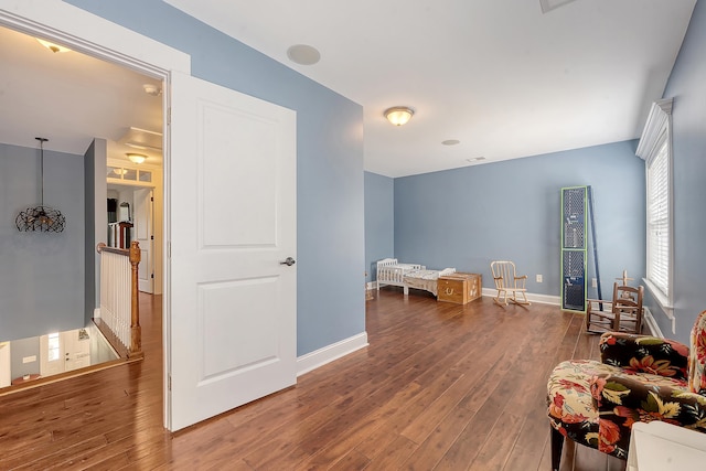 playroom with wood finished floors and baseboards