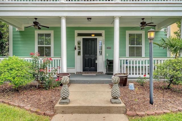entrance to property featuring ceiling fan and covered porch