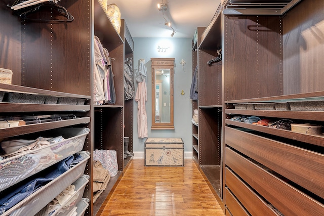 walk in closet featuring light wood-style flooring