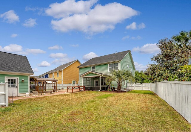 rear view of property featuring a sunroom