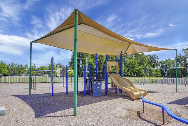 community jungle gym featuring fence