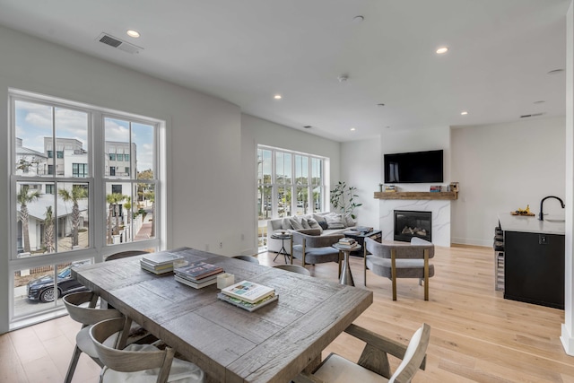 405 Spartina Ln Unit 405, Charleston, SC 29492 - dining area featuring a premium fireplace, light wood-style floors, and recessed lighting