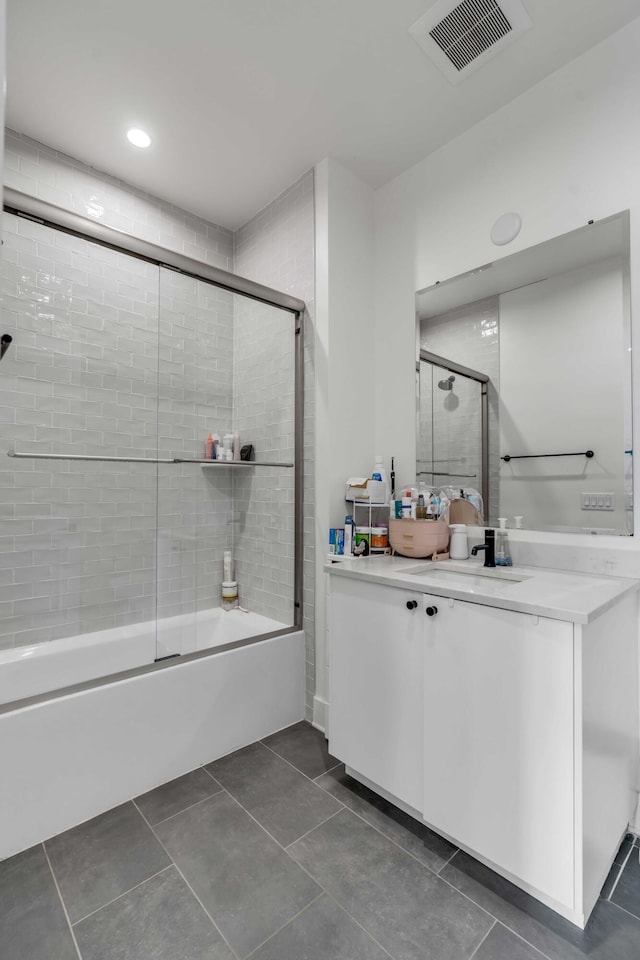 405 Spartina Ln Unit 405, Charleston, SC 29492 - full bath with combined bath / shower with glass door, vanity, tile patterned flooring, and recessed lighting