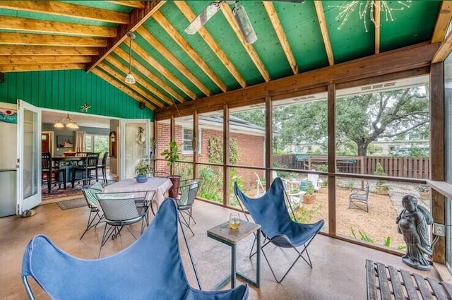 sunroom / solarium with outdoor dining space