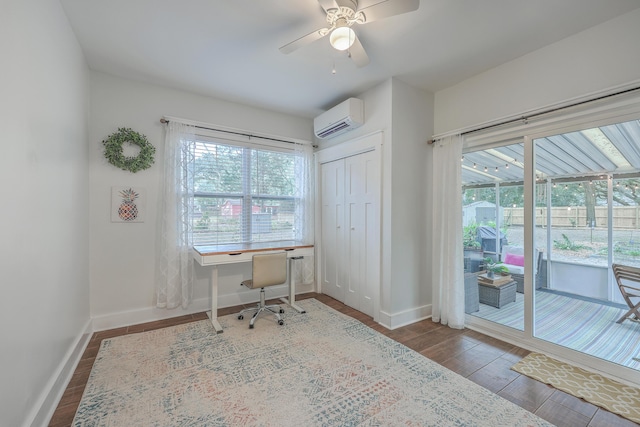 home office featuring a wall mounted AC, ceiling fan, and wood-type flooring