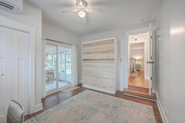 doorway with a wall mounted air conditioner and ceiling fan