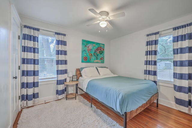 bedroom featuring hardwood / wood-style flooring and ceiling fan