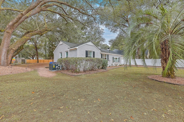 exterior space with a yard and cooling unit