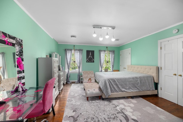 bedroom featuring wood-type flooring and crown molding