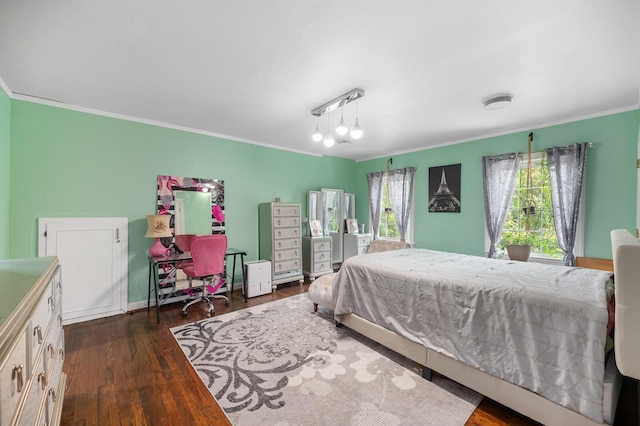 bedroom featuring ornamental molding and dark hardwood / wood-style flooring