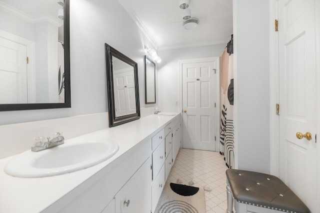 bathroom featuring ornamental molding, vanity, and ceiling fan