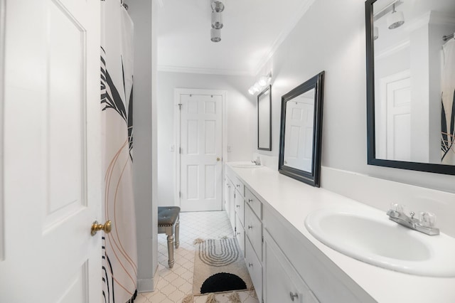 bathroom featuring crown molding and vanity