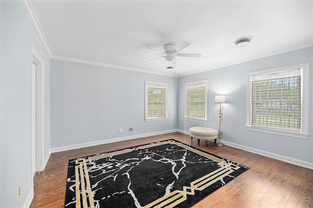 sitting room featuring hardwood / wood-style flooring, ceiling fan, and ornamental molding