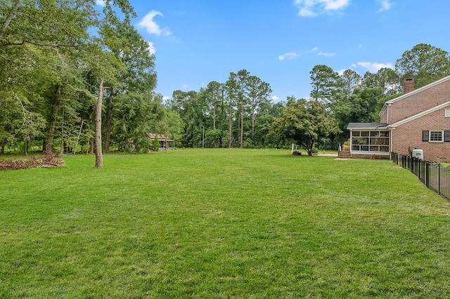 view of yard with a sunroom