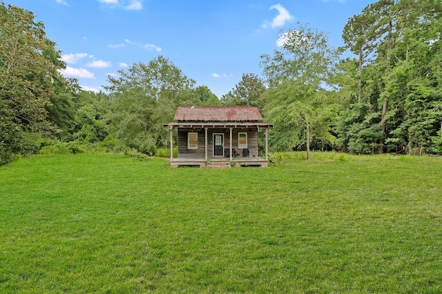 view of yard featuring covered porch